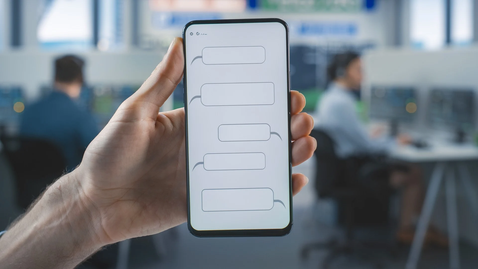 TEMSİLİ — 000 acil hattı için SMS denemesini simgeleyen telefon ve çağrı merkezi.